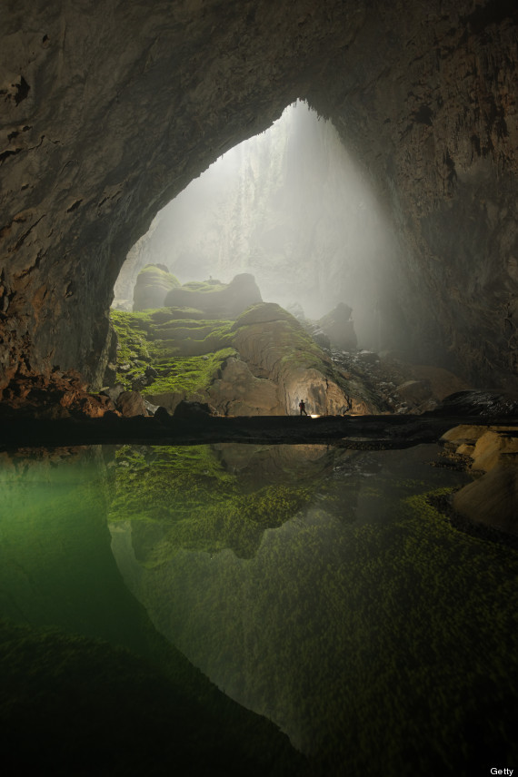 A rock formation shines beneath a skylight in Hang Son Doong.
